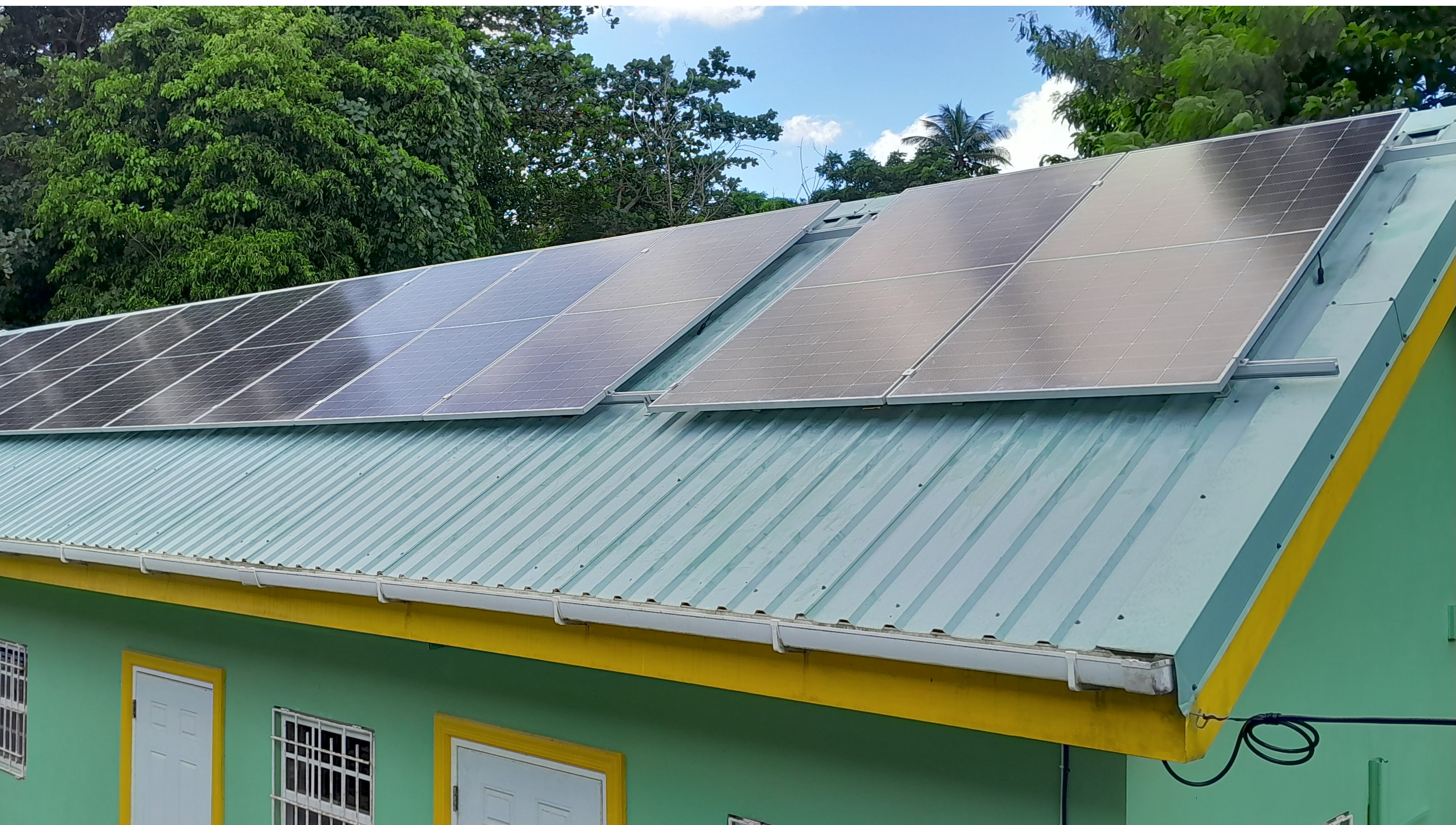 Solar PV system installation on residential roof in St. Lucia showing professional solar panel mounting