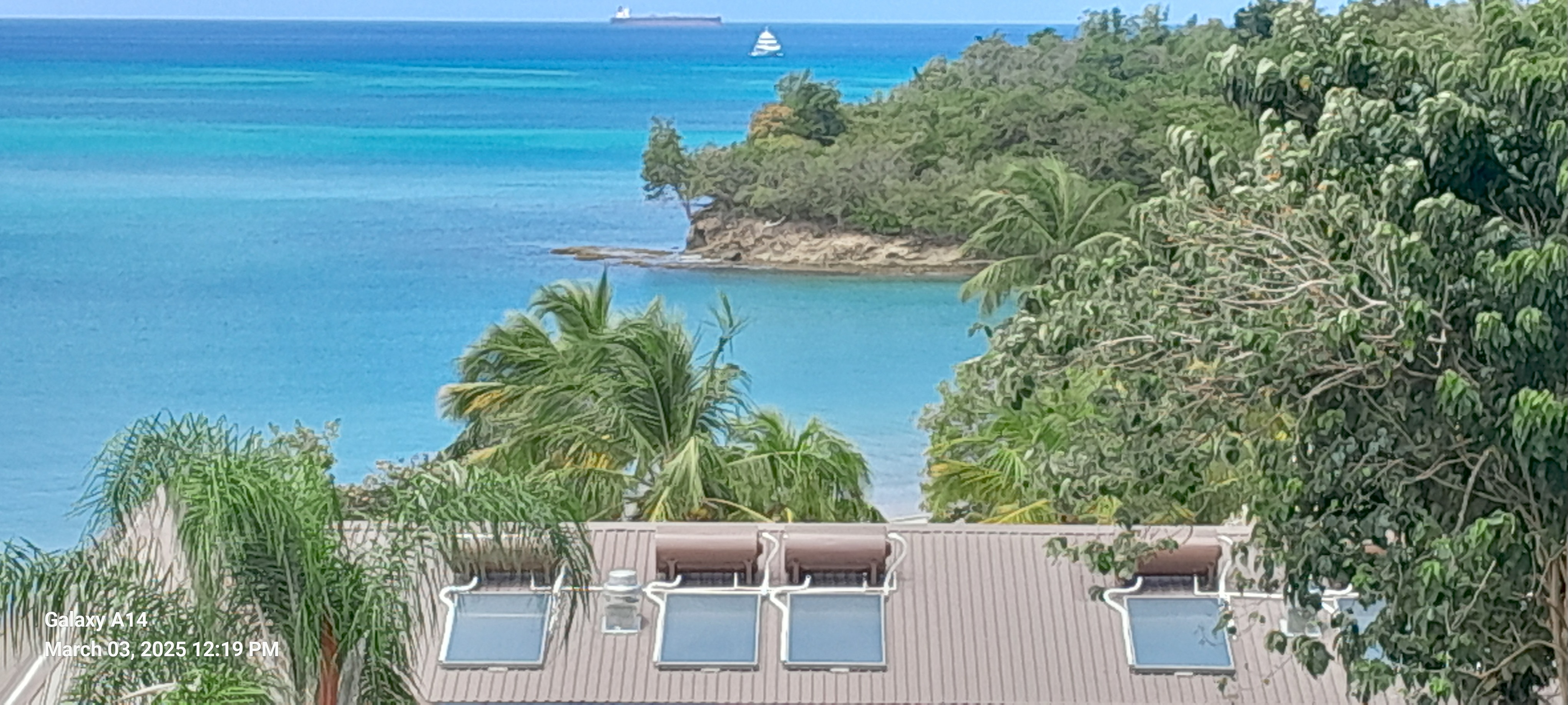 Evacuated tube solar water heater installation on residential property in St. Lucia