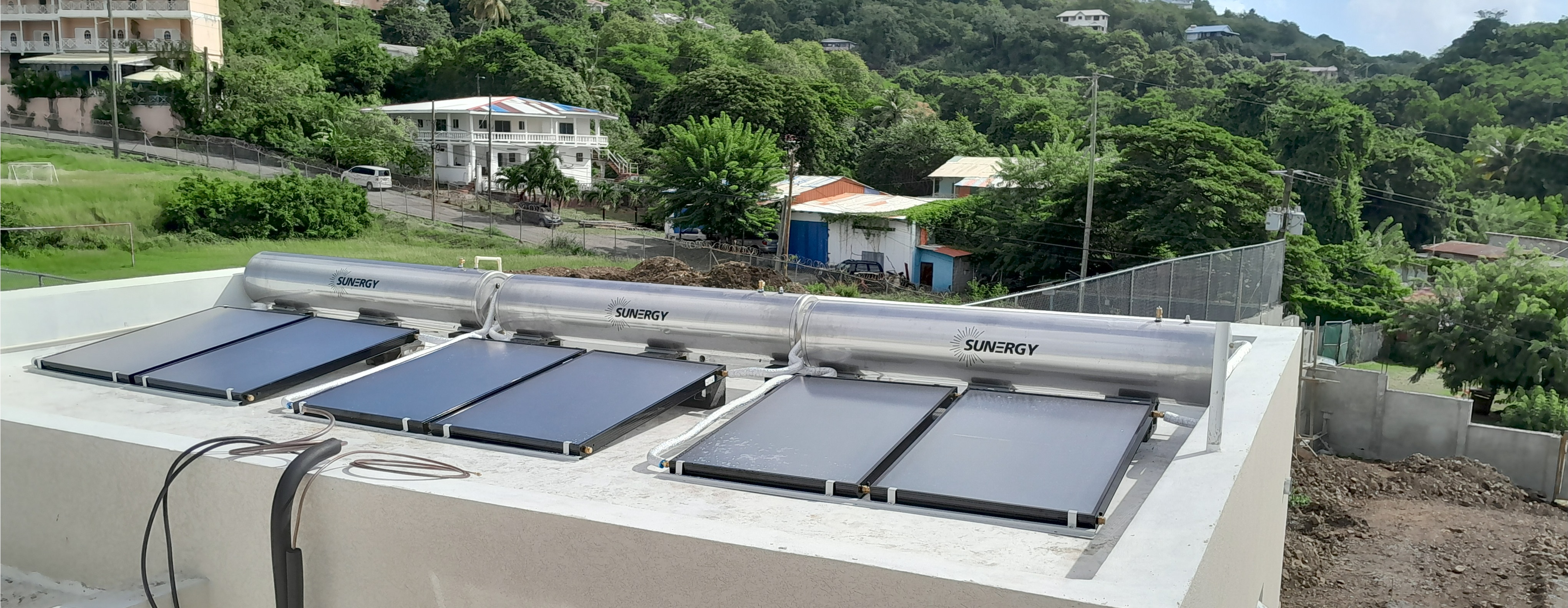 Professional solar water heater system installation with storage tank and solar collectors